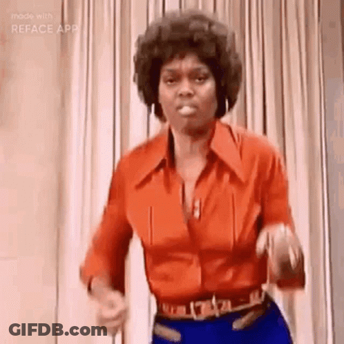 A Woman In A Red Shirt And Blue Pants Is Dancing . GIF