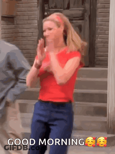 A Woman In A Red Shirt Is Clapping Her Hands And The Words Good Morning Are Above Her GIF