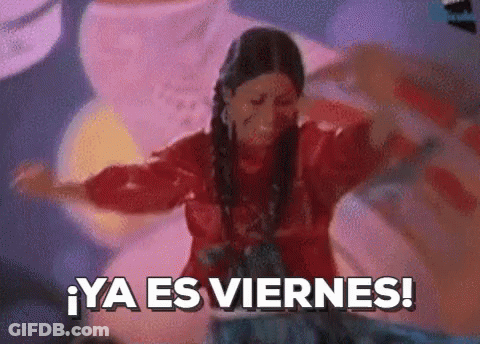 A Woman In A Red Shirt Is Dancing With The Words Ya Es Viernes In The Background GIF