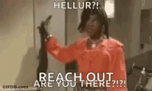 A Woman In A Red Shirt Is Holding A Gun And Says `` Hellur ? Reach Out Are You There ? '' . GIF