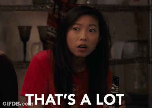A Woman In A Red Shirt Is Holding A Remote Control And Says That 'S A Lot GIF