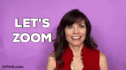 A Woman In A Red Shirt Is Making A Funny Face And Saying `` Let 'S Zoom '' . GIF