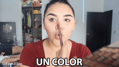 A Woman In A Red Shirt Is Making A Funny Face And The Words Un Color Are Above Her Face GIF