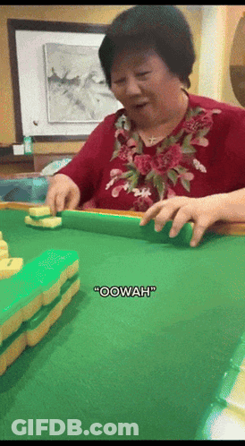 A Woman In A Red Shirt Is Playing Mahjong And Says " Oowah " GIF