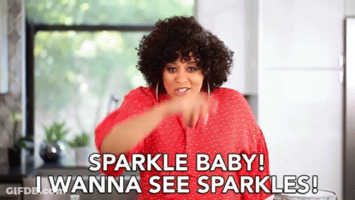 A Woman In A Red Shirt Is Saying Sparkle Baby ! I Wanna See Sparkles . GIF