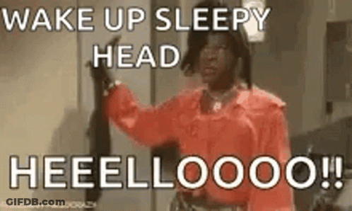 A Woman In A Red Shirt Is Saying `` Wake Up Sleepy Head Heeelloooo !! '' GIF