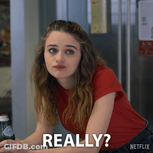 A Woman In A Red Shirt Is Sitting At A Table With A Bottle Of Soda And The Words Really Written On The Bottom GIF
