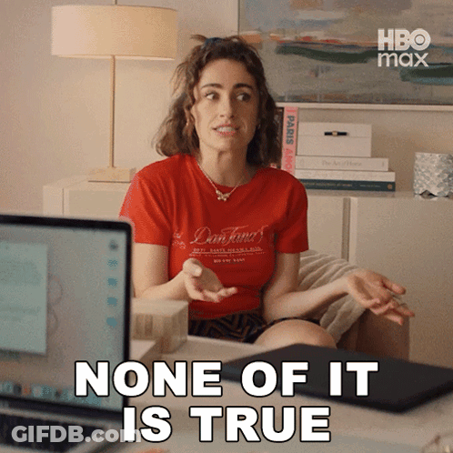 A Woman In A Red Shirt Is Sitting In Front Of A Laptop Computer And Says None Of It Is True GIF