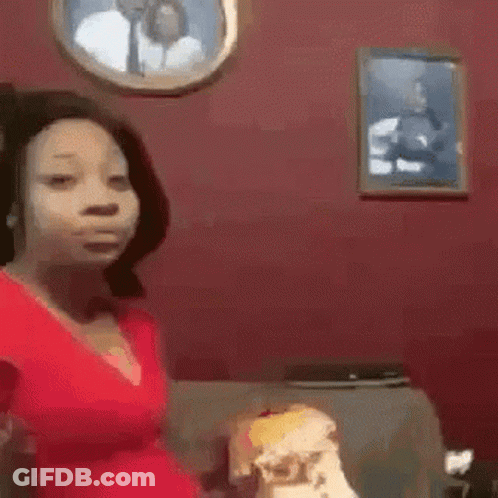 Woman In Red Shirt Sitting In Front Of Man And Woman Picture GIF