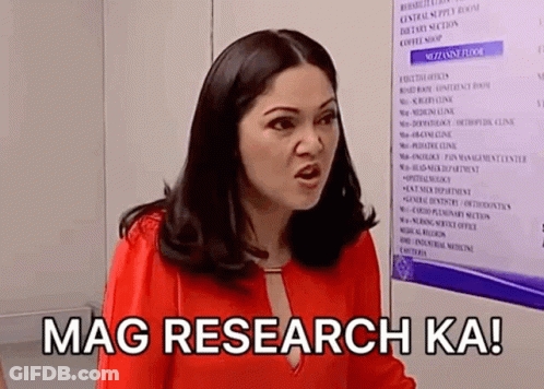 A Woman In A Red Shirt Is Standing In Front Of A Sign That Says Mag Research Ka ! GIF