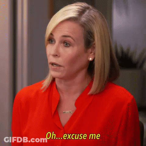 A Woman In A Red Shirt Is Talking And Saying `` Oh Excuse Me '' . GIF