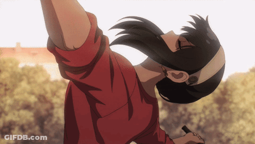 A Woman In A Red Shirt Is Upside Down With Her Arm Outstretched GIF