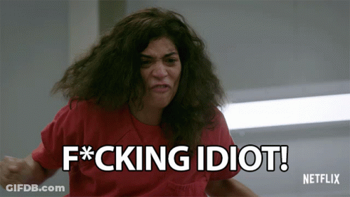 A Woman In A Red Shirt Says Fucking Idiot GIF
