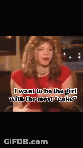 A Woman In A Red Shirt Says " I Want To Be The Girl With The Most " Cake " GIF