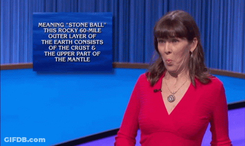 A Woman In A Red Shirt Stands In Front Of A Sign That Says " What " GIF