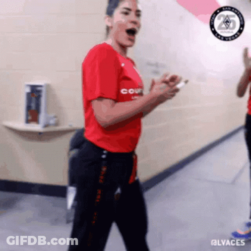 A Woman In A Red Shirt That Says Court Is Dancing GIF