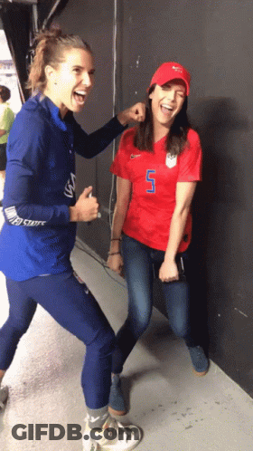 A Woman In A Red Shirt With The Number 7 On It GIF