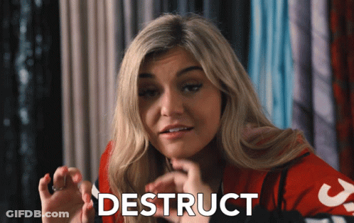 A Woman In A Red Shirt With The Word Destruct Written On Her Face GIF