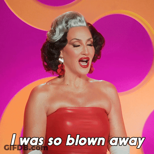 A Woman In A Red Strapless Dress Says I Was So Blown Away GIF