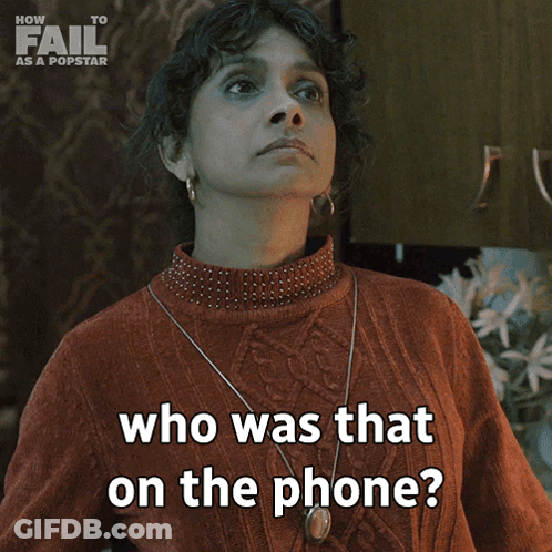 A Woman In A Red Sweater Is Asking Who Was That On The Phone GIF