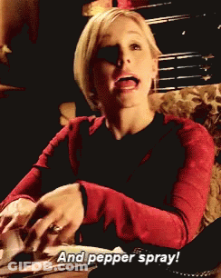 A Woman In A Red Sweater Says " And Pepper Spray " While Sitting On A Couch GIF