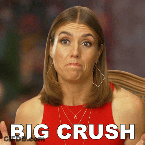 A Woman In A Red Tank Top Is Making A Funny Face And The Words Big Crush Are Behind Her GIF