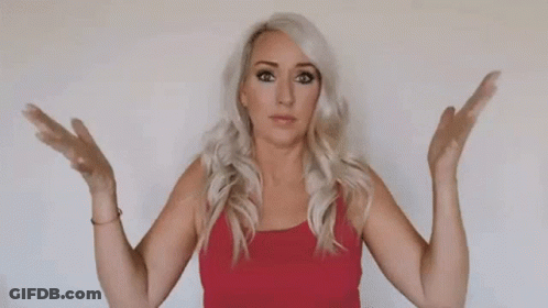 A Woman In A Red Tank Top Is Standing With Her Arms Outstretched . GIF