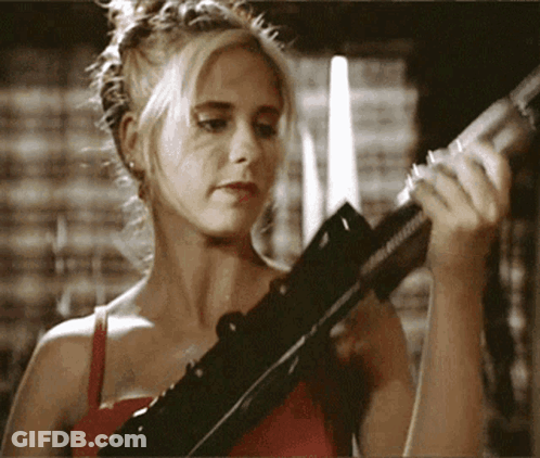 Woman In Red Top Holding Rifle GIF