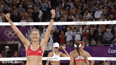 A Woman In A Red Top With The Letter F On It Stands In Front Of A Net That Says London 2012 GIF