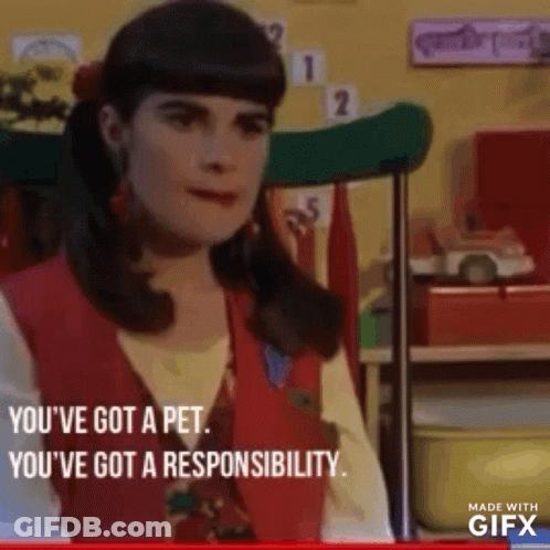 A Woman In A Red Vest Is Sitting In A Chair In A Room And Talking To Someone . GIF