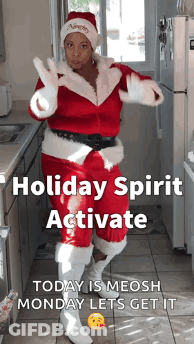 A Woman In A Santa Suit Is Dancing In A Kitchen With The Caption Holiday Spirit Activate Today Is Meosh Monday Lets Get GIF