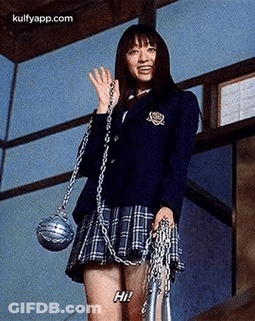 A Woman In A School Uniform Is Holding A Chain And A Rope . GIF