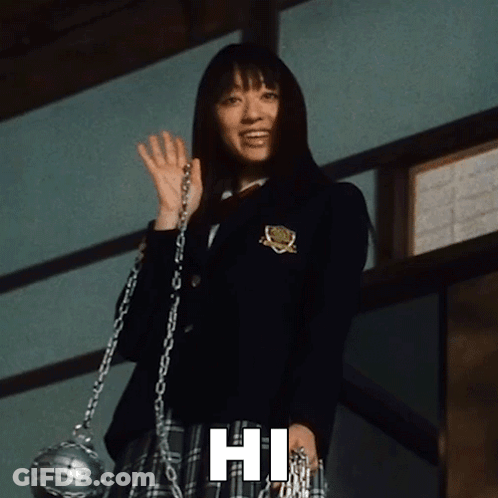 A Woman In A School Uniform Is Holding A Chain And Waving With The Phrase Hi Below Her GIF