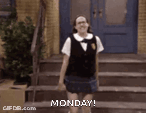 A Woman In A School Uniform Is Standing On A Set Of Stairs And Says Monday . GIF