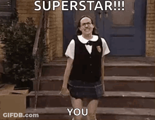 A Woman In A School Uniform Is Standing On A Set Of Stairs And Says `` Superstar !!! You '' . GIF