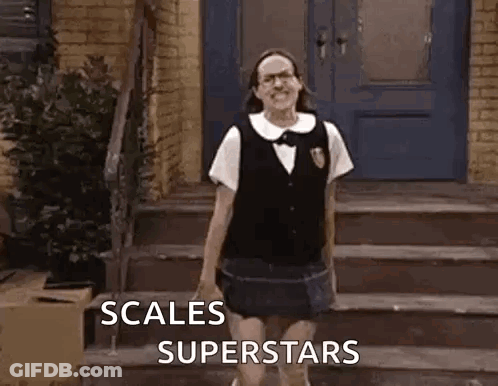 A Woman In A School Uniform Is Standing On A Set Of Stairs In Front Of A House . GIF