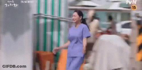 A Woman In A Scrub Is Jumping A Rope In A Blurry Photo . GIF