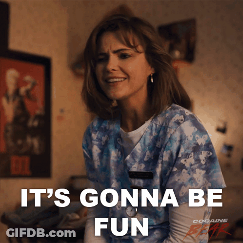 A Woman In A Scrub Top Is Smiling And Says It 'S Gonna Be Fun GIF