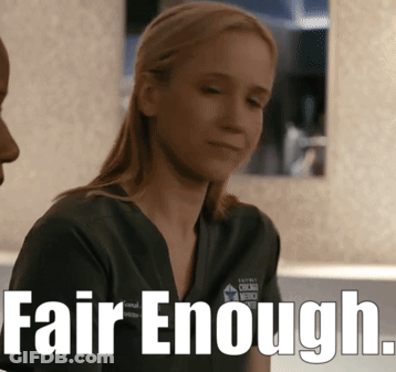 A Woman In A Scrub Top With The Words Fair Enough On The Bottom GIF