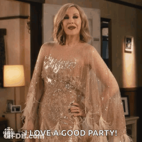 A Woman In A Sequined Gown Says " Love A Good Party " GIF