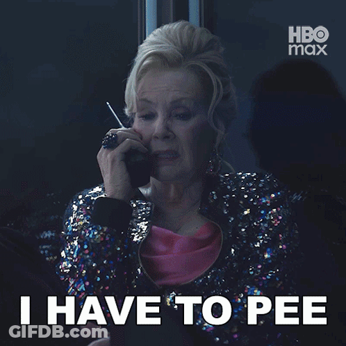 A Woman In A Sequined Jacket Is Talking On A Cell Phone And The Caption Says " I Have To Pee " GIF