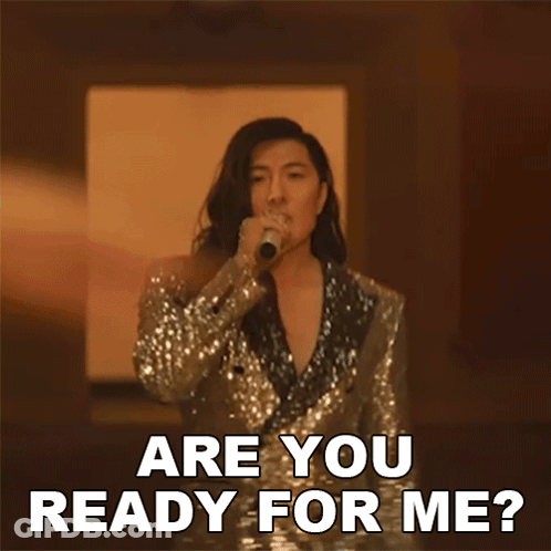 A Woman In A Sequined Suit Is Singing Into A Microphone And Says " Are You Ready For Me ? " GIF