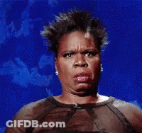 A Woman In A Sheer Top Is Making A Funny Face Against A Blue Background . GIF