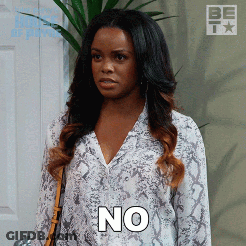 A Woman In A Snake Print Shirt Has The Word No On Her Chest GIF
