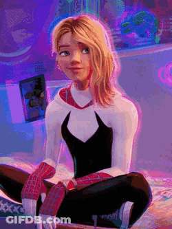 A Woman In A Spiderman Costume Is Sitting On A Bed . GIF