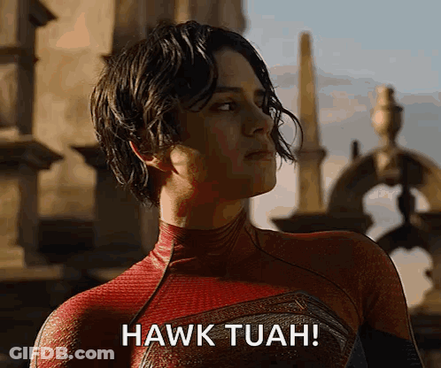 A Woman In A Spiderman Costume Says " Hawk Tuah " GIF