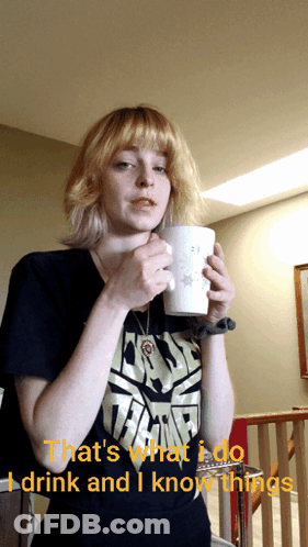 A Woman In A Star Wars Shirt Drinks From A Cup GIF
