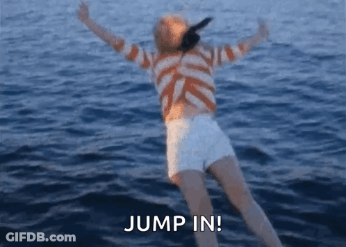 A Woman In A Striped Shirt And White Shorts Is Jumping In The Water . GIF