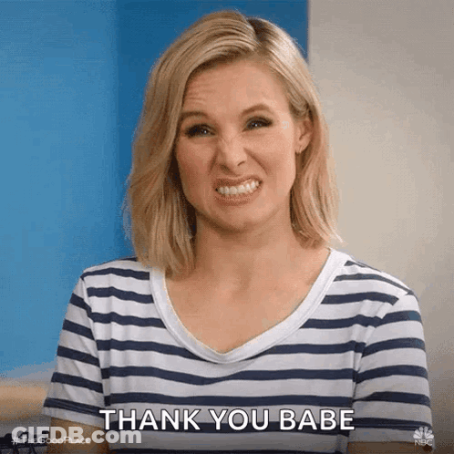 A Woman In A Striped Shirt Is Making A Funny Face And Saying Thank You Babe . GIF