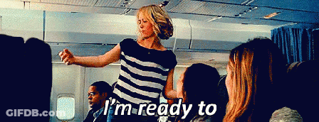 A Woman In A Striped Shirt Says I 'M Ready To On A Plane GIF